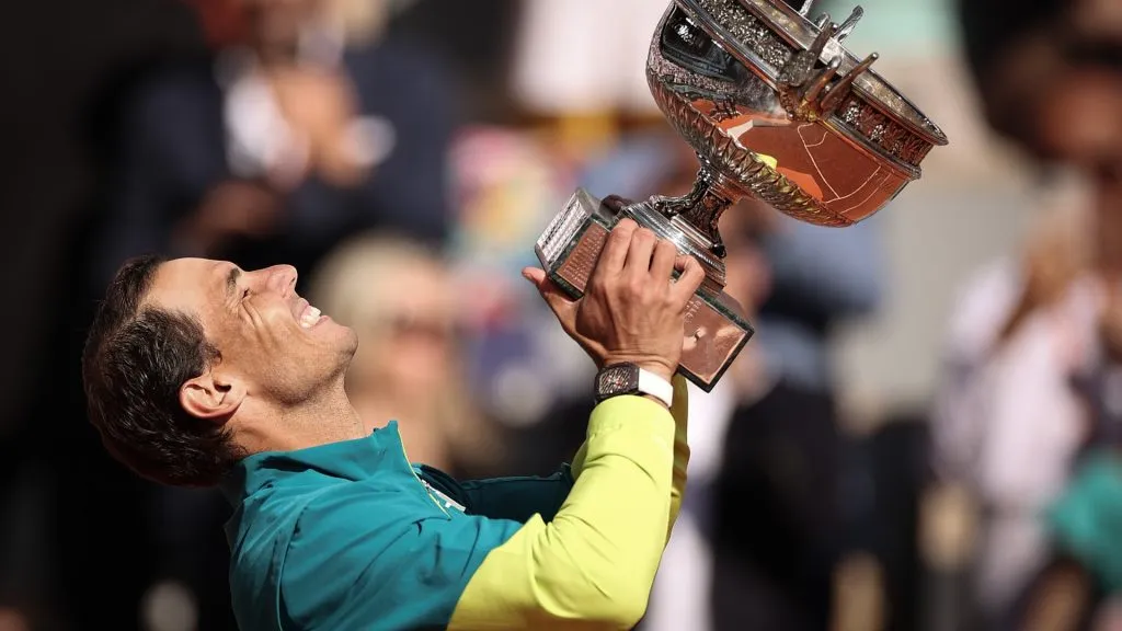 Rafael Nadal of Spain celebrates with the trophy after winning against Casper Ruud of Norway during the Men’s Singles Final match on Day 15 of The 2022 French Open. (Source: Ryan Pierse/Getty Images)