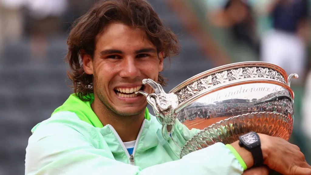 Rafael Nadal of Spain celebrates with the trophy after winning the men’s singles final match between Rafael Nadal and Robin Soderling on day fifteen of the French Open in 2010. (Source: Julian Finney/Getty Images)
