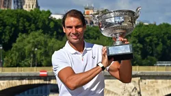 Rafael Nadal of Spain poses with the Musketeers trophy after winning his 14th Roland Garros Grand Chelem tournament on Alexander the 3rd bridge on June 06, 2022.