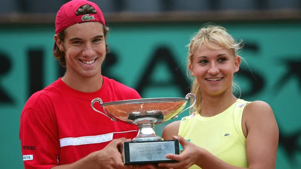 Tatiana Golovin and Richard Gasquet of France celebrate with the trophy after winning their mixed doubles Roland Garros. (Clive Brunskill/Getty Images)