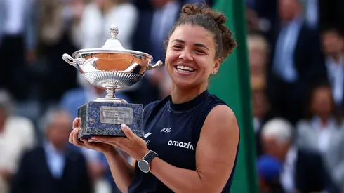 Jasmine Paolini of Italy poses for a photo with the trophy following victory against Coco Gauff of United States at the Rome Open.