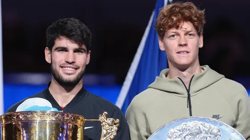 Jannik Sinner and Carlos Alcaraz pose with their trophies