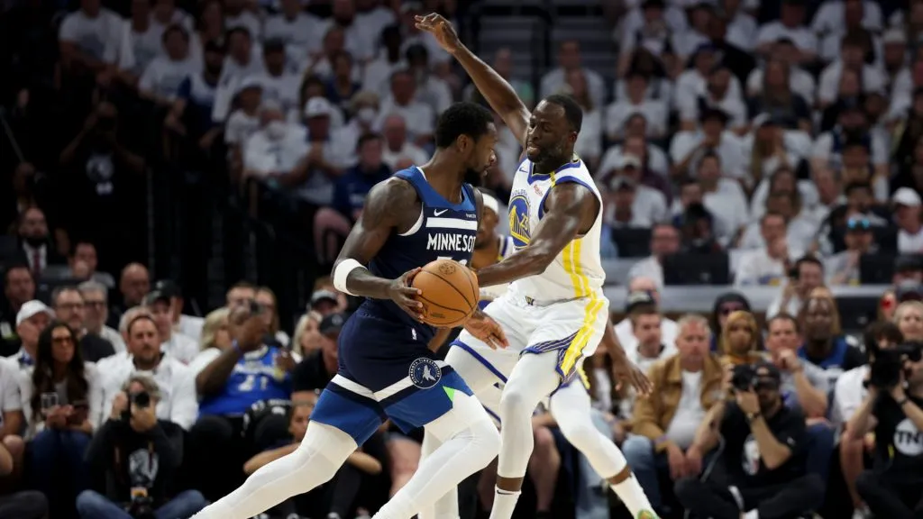 Julius Randle #30 of the Minnesota Timberwolves dribbles against Draymond Green #23 of the Golden State Warriors