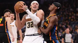 Aaron Gordon #32 of the Denver Nuggets posts up against Shai Gilgeous-Alexander #2 of the Oklahoma City Thunder during the third quarter of round two Game One of the 2025 NBA Playoffs at Paycom Center on May 05, 2025 in Oklahoma City, Oklahoma.