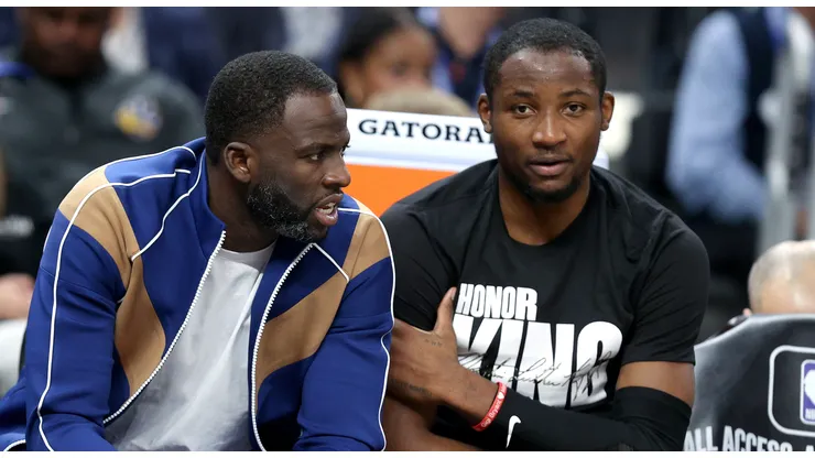 Draymond Green speaks to Jonathan Kuminga of the Golden State Warriors.