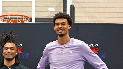 Stephon Castle (2R) of the San Antonio Spurs poses with Tim Duncan (2L), David Robinson (L) and Wembanyama (R) after he was named NBA Rookie of the Year
