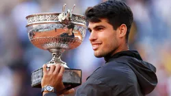 Carlos Alcaraz of Spain celebrates with the winners trophy after victory in the Men's Singles Final match between Alexander Zverev of Germany and Carlos Alcaraz of Spain on Day 15 of the 2024 French Open.