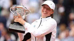Iga Swiatek of Poland celebrates with her winners trophy after victory against Karolina Muchova of Czech Republic in the Women's Singles Final match on Day Fourteen of the 2023 French Open.