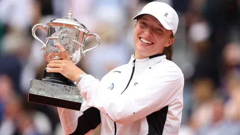 Iga Swiatek of Poland celebrates with her winners trophy after victory against Karolina Muchova of Czech Republic in the Women's Singles Final match on Day Fourteen of the 2023 French Open.