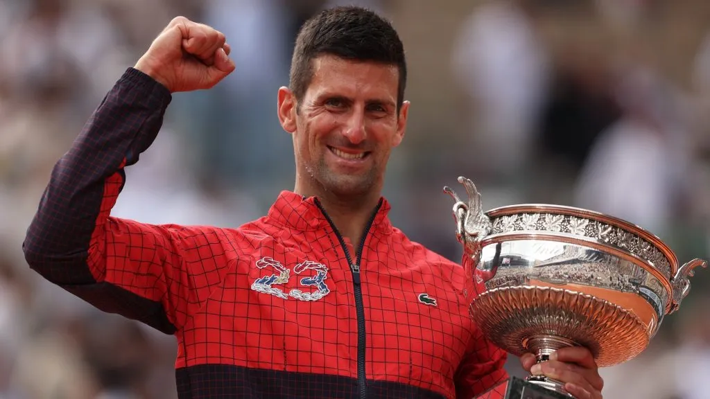 Novak Djokovic of Serbia celebrates with the winners trophy after victory against Casper Ruud of Norway in the Men’s Singles Final match on Day Fifteen of the 2023 French Open. (Source: Julian Finney/Getty Images)
