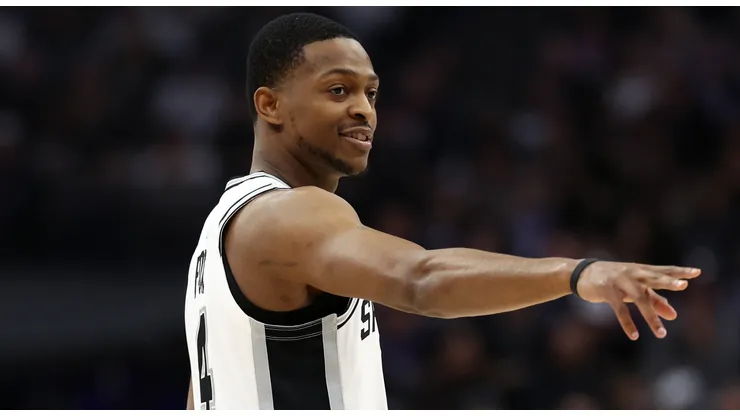 De'Aaron Fox #4 of the San Antonio Spurs points back towards the Sacramento Kings' bench before his first game back in Sacramento after being traded from the Sacramento Kings at Golden 1 Center on March 07, 2025 in Sacramento, California.