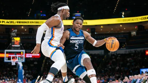 Anthony Edwards #5 of the Minnesota Timberwolves dribbles the ball to the basket around Luguentz Dort #5 of the Oklahoma City Thunder during the fourth quarter at Paycom Center on February 24, 2025 in Oklahoma City, Oklahoma.
