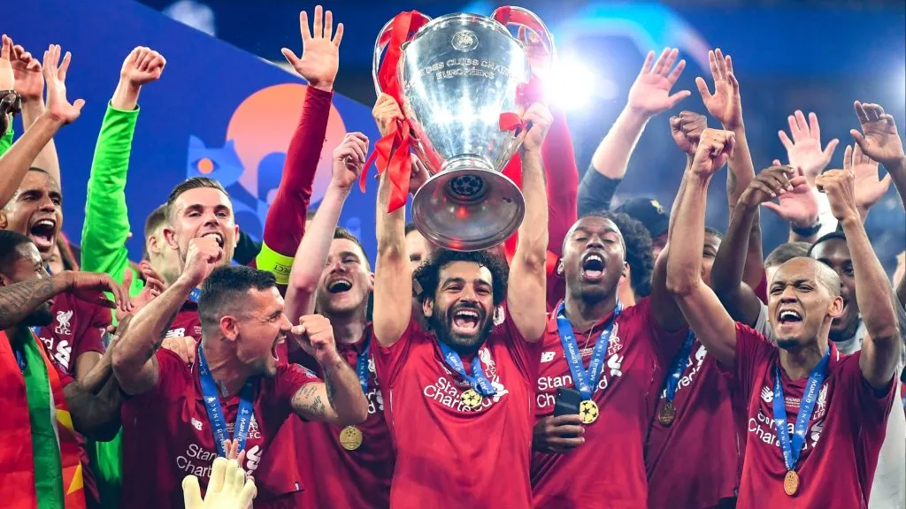 Mohamed Salah of Liverpool celebrates with the Champions League Trophy after winning the UEFA Champions League Final between Tottenham Hotspur and Liverpool in 2019. (Source: Michael Regan/Getty Images)