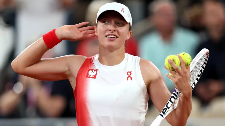 Iga Swiatek of Team Poland celebrates victory against Irina-Camelia Bego of Team Romania during the Women's Singles First Round on day one of the Olympic Games Paris 2024.