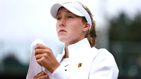 Mirra Andreeva looks on during a break between sets as she plays against Brenda Fruhvirtova of Czechia in her Ladies' Singles first round match on day one of The Championships Wimbledon 2024.