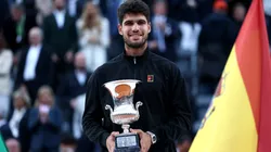 Carlos Alcaraz of Spain poses with the trophy as he celebrates victory against Jannik Sinner after the Rome Open final.