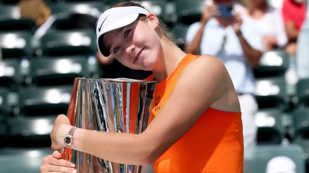 Mirra Andreeva hugs her winners trophy after her three set victory against Aryna Sabalenka during the Women’s Singles Final of the BNP Paribas Open at Indian Wells Tennis Garden in 2025. (Source: Clive Brunskill/Getty Images)
