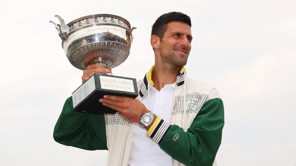 Novak Djokovic poses with the trophy after winning the title in the 2023 French Open