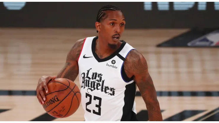 Lou Williams #23 of the LA Clippers controls the ball against the Denver Nuggets in the first quarter at AdventHealth Arena at ESPN Wide World Of Sports Complex on August 12, 2020 in Lake Buena Vista, Florida.