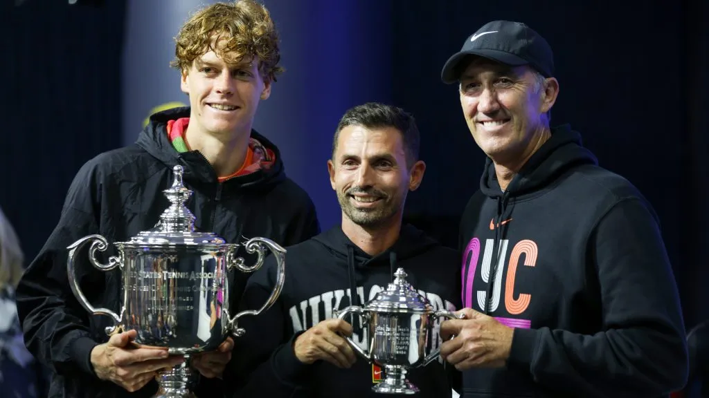 Jannik Sinner of Italy poses for a photo with Simone Vagnozzi and Darren Cahill at the press conference after defeating Taylor Fritz at the 2024 US Open.