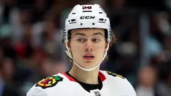 Connor Bedard #98 of the Chicago Blackhawks looks on during the first period against the Seattle Kraken at Climate Pledge Arena on December 14, 2023 in Seattle, Washington.