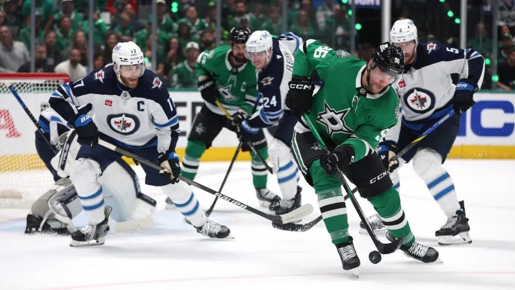 Mikko Rantanen #96 of the Dallas Stars controls the puck against Adam Lowry #17 of the Winnipeg Jets during the first period in Game Six of the Second Round of the 2025 Stanley Cup Playoffs at American Airlines Center on May 17, 2025 in Dallas, Texas. (Photo by Sam Hodde/Getty Images)