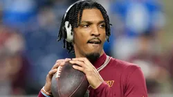 Jayden Daniels #5 of the Washington Commanders warms up prior to playing the Detroit Lions in the NFC Divisional Playoff at Ford Field on January 18, 2025 in Detroit, Michigan.