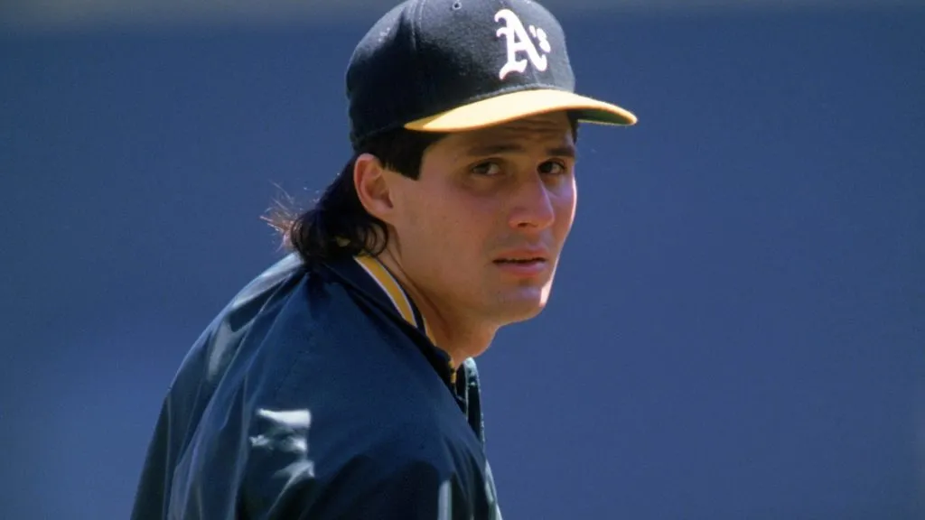 Jose Canseco #33 of the Oakland Athletics looks on during practice prior to a 1989 MLB season game. (Source: Otto Greule Jr/Getty Images)