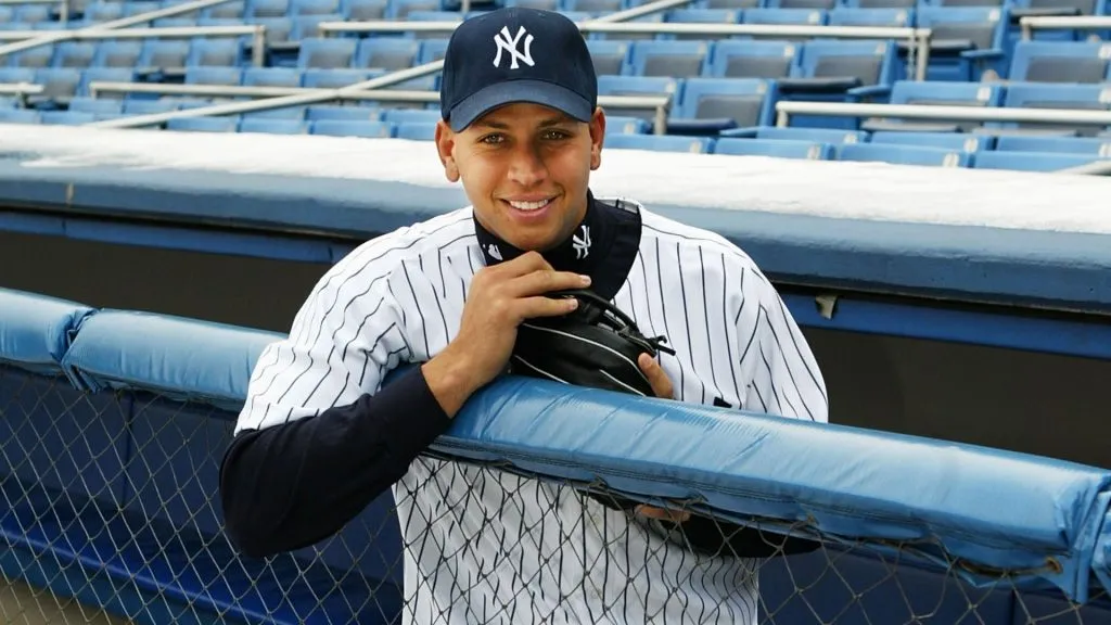 Alex Rodriguez stands in the Yankee dugout after a press conference that announced him as the newest New York Yankee on February 17, 2004. (Source: Ezra Shaw/Getty Images)
