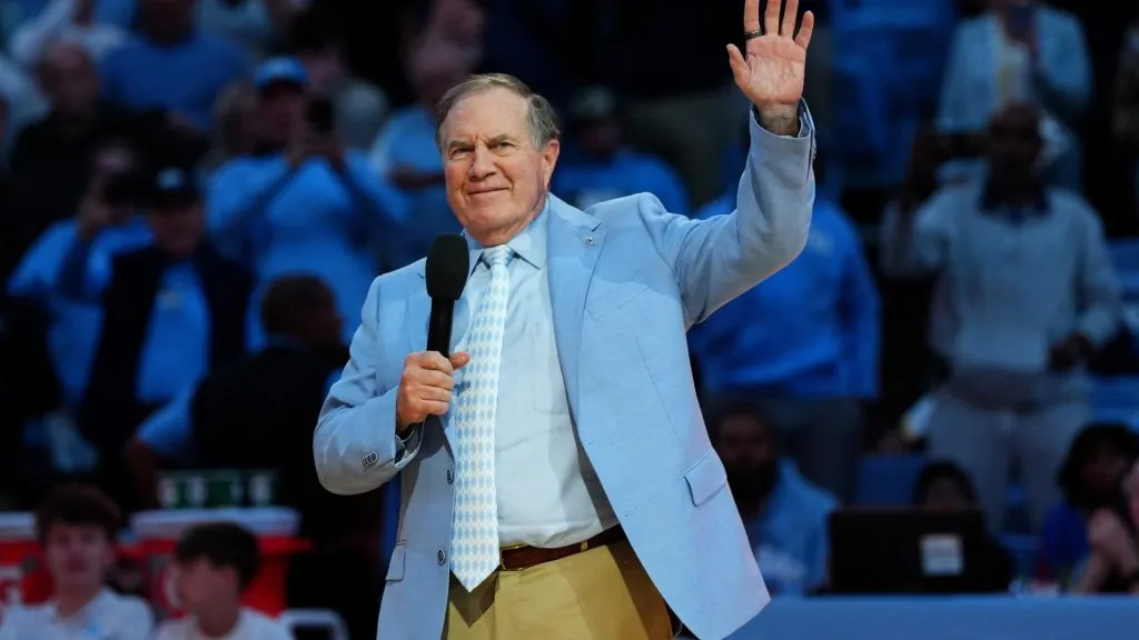 Head coach Bill Belichick of the North Carolina Tar Heels addresses the crowd during halftime in the game against the La Salle Explorers on December 14, 2024. (Source: Grant Halverson/Getty Images)