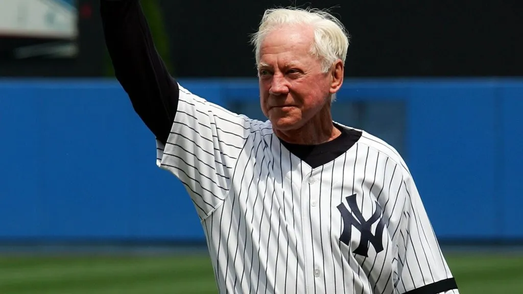 Former New York Yankee Whitey Ford salutes the crowd during Old Timers Day ceremonies before the Yankees play the Los Angeles Angels of Anaheim on July 7, 2007. (Source: Jim McIsaac/Getty Images)
