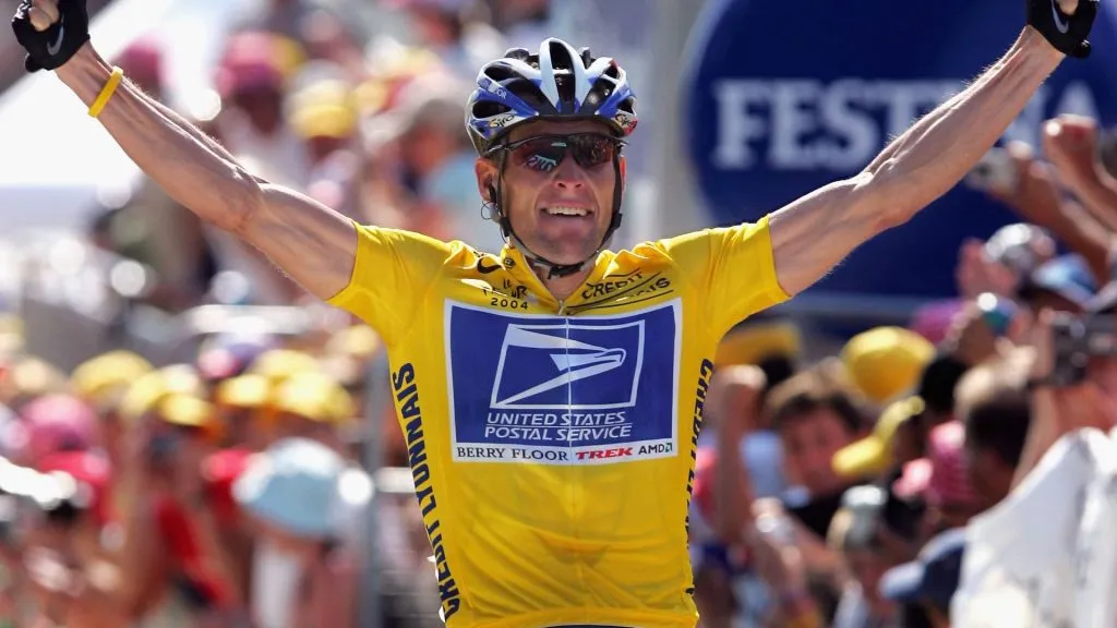 Lance Armstrong of the USA and riding for US Postal Service presented by Berry Floor celebrates as he wins stage 17 of the Tour de France on July 22, 2004. (Source: Doug Pensinger/Getty Images)