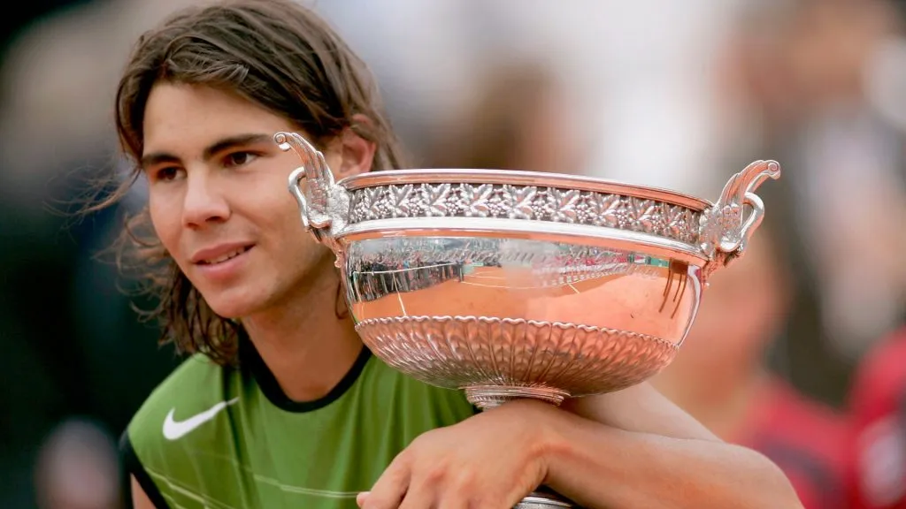 Rafael Nadal of Spain poses with the winners trophy after his 3-1 sets victory over Mariano Puerta of Argentina during the 2005 Roland Garros. (Michael Steele/Getty Images)