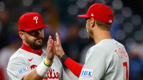 Kyle Schwarber #12 and Trea Turner #7 of the Philadelphia Phillies celebrate after their 9-3 win against the Colorado Rockies at Coors Field on May 19, 2025 in Denver, Colorado.