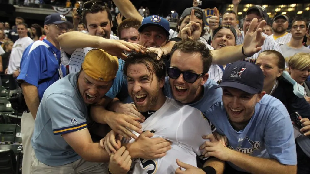 Taylor Green #5 of the Milwaukee Brewers celebrates with the fans after the Brewers 3-2 10 inning victory against the Arizona Diamondbacks the National League Division Series in 2011. (Source: Jonathan Daniel/Getty Images)