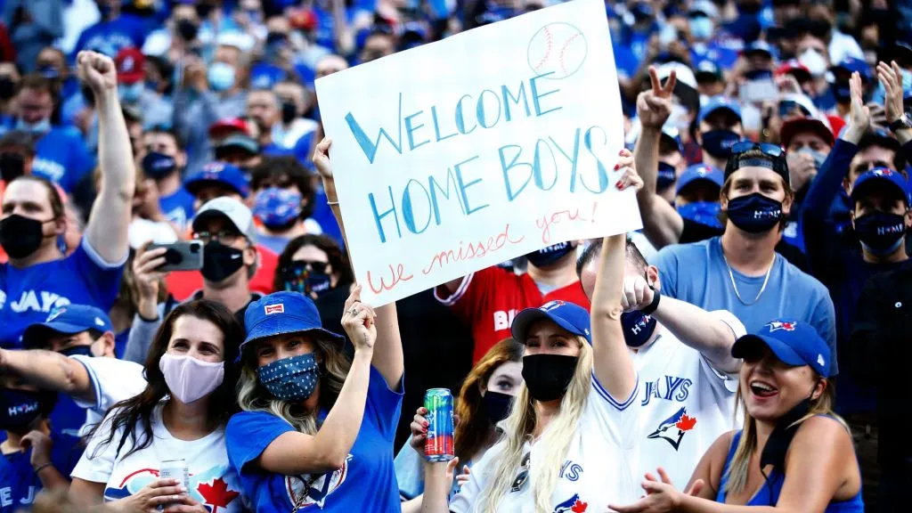 Toronto Blue Jays fans cheer as the team makes their way onto the field for their first home game in Toronto this season prior to a MLB game against the Kansas City Royals in 2021. (Source: Vaughn Ridley/Getty Images)