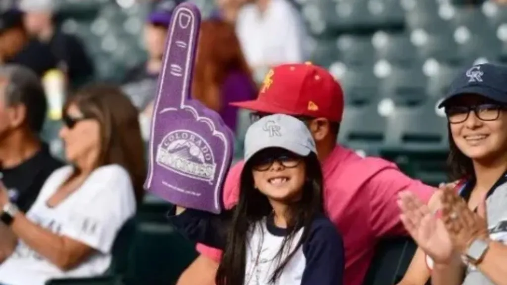 Colorado Rockies young fan in stands wearing foam finger during a game (Source: Getty Images)