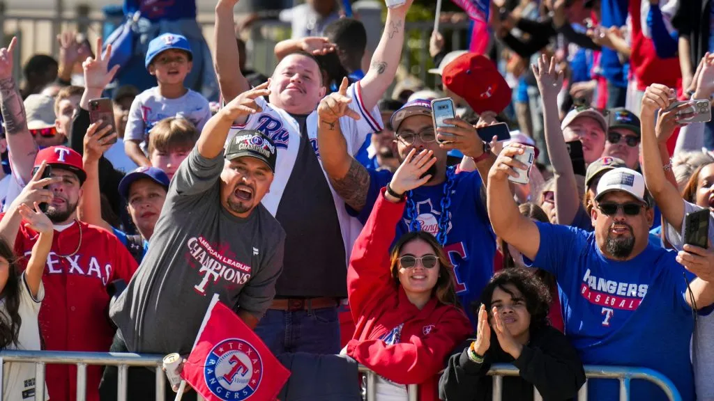 Fans cheer a passing player along the parade route during the Texas Rangers World Series victory parade on November 3, 2023. (Source: Smiley Pool – Pool/Getty Images)