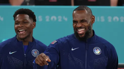 Anthony Edwards #5 and LeBron James #6 of Team United States celebrate on the podium during the Men's basketball medal ceremony on day fifteen of the Olympic Games Paris 2024 at Bercy Arena on August 10, 2024 in Paris, France.
