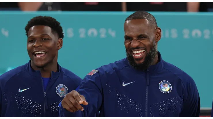 Anthony Edwards #5 and LeBron James #6 of Team United States celebrate on the podium during the Men's basketball medal ceremony on day fifteen of the Olympic Games Paris 2024 at Bercy Arena on August 10, 2024 in Paris, France.