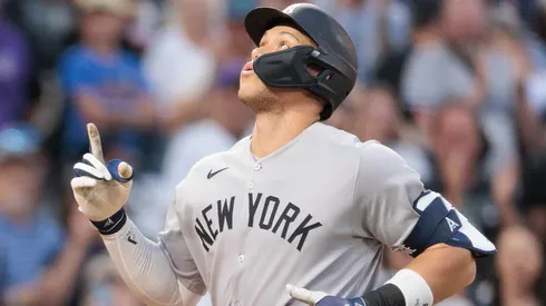 Aaron Judge #99 of the New York Yankees reacts after hitting a home run during the fifth inning against the Colorado Rockies at Coors Field on May 23, 2025 in Denver, Colorado.