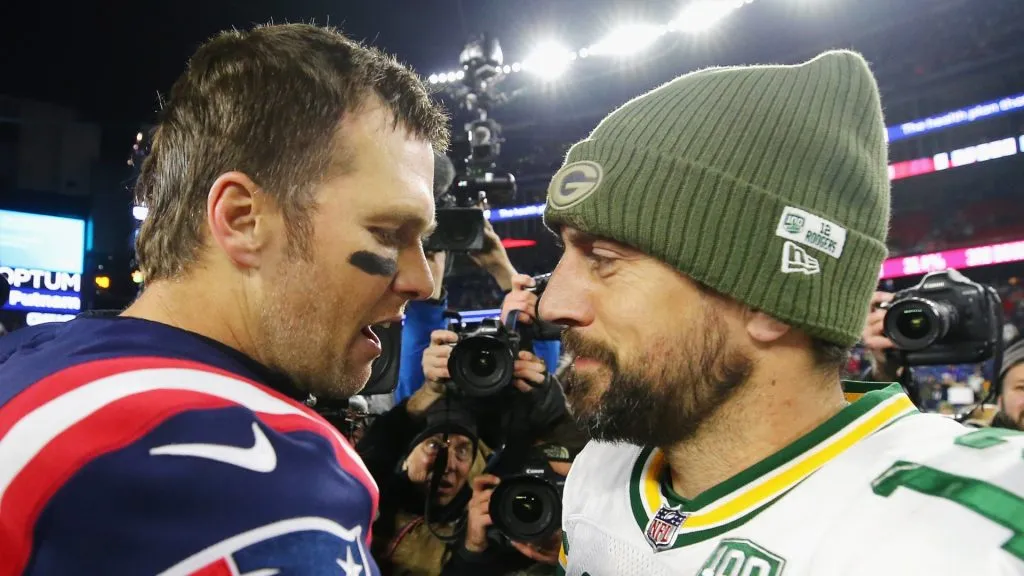 Tom Brady #12 of the New England Patriots talks with Aaron Rodgers #12 of the Green Bay Packers after the Patriots defeated the Packers 31-17 at Gillette Stadium on November 4, 2018 in Foxborough, Massachusetts.