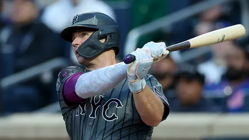Pete Alonso #20 of the New York Mets hits a two run home run in the first inning as Will Smith #16 of the Los Angeles Dodgers defends at Citi Field on May 25, 2025 in the Flushing neighborhood of the Queens borough of New York City.