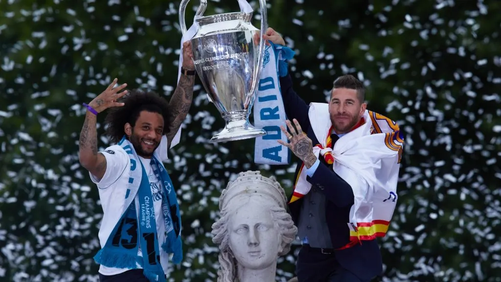 Sergio Ramos of Real Madrid holds up the Champions League trophy with his teammate Marcelo as they celebrate a day after winning their 13th European Cup and UEFA Champions League Final in 2018. (Source: Gonzalo Arroyo Moreno/Getty Images)