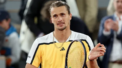 Alexander Zverev of Germany celebrates winning match point against Alex De Minaur of Australia during the Men's Singles Quarter Final match on Day 11 at Roland Garros on June 05, 2024.
