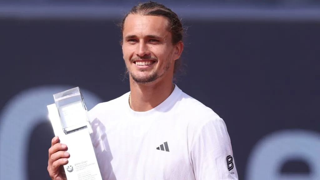 Alexander Zverev poses with the trophy and a pair of Lederhosen after winning the final match against Ben Shelton on day nine of the BMW Open in 2025. (Source: Alexander Hassenstein/Getty Images for BMW)