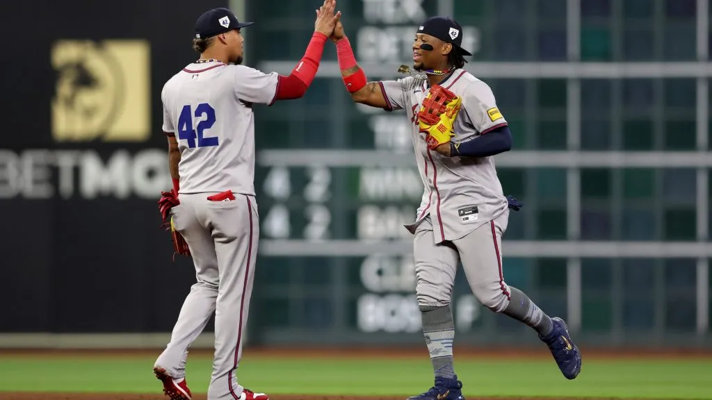 HOUSTON, TEXAS – APRIL 15: Ronald Acuña Jr. #13 of the Atlanta Braves and Orlando Arcia #11 celebrate after defeating the Houston Astros at Minute Maid Park on April 15, 2024 in Houston, Texas.  All players are wearing the number 42 in honor of Jackie Robinson Day. (Photo by Tim Warner/Getty Images)