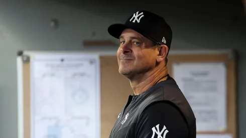Manager Aaron Boone #17 and Aaron Judge #99 of the New York Yankees look on during the third inning Mariners at T-Mobile Park on May 14, 2025 in Seattle, Washington.