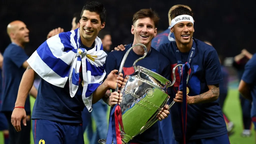 Luis Suarez, Lionel Messi and Neymar of Barcelona celebrate with the trophy after the UEFA Champions League Final against Juventus on June 6, 2015. (Source: Matthias Hangst/Getty Images)