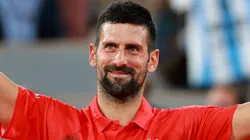 Novak Djokovic of Serbia celebrates winning match point against Mackenzie McDonald of United States during Roland Garros.